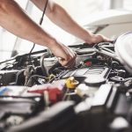 Kinghams Car Repairs Croydon mechanic repairing a car in the garage